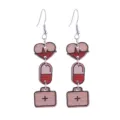 Close-up detail of nurse day medical wooden drop earrings featuring heart ekg and pill charms. - Heart EKG Style