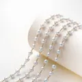 Close-up of delicate white pearl bead chain linked with gold metal connectors for jewelry. - 3mm Bead Diameter-1 Meter / Gold Chain