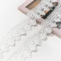 Close-up detail of white lace trimming, delicate hollow-out embroidery for DIY crafts and hair accessories. - Basic Style (AC4980) / 5.8cm