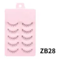 Nahaufnahme von fünf Paar nahtlosen falschen Wimpern auf einer rosa Kunststoffeinfassung. - Angelschnur Stil (ZB28) / 5 Paar Set