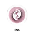 Nahaufnahme von selbstklebenden künstlichen Wimpern in einer runden rosafarbenen Glitzerbox. - Halbschnitt-Stil (B95)