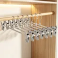 Cintres à pantalons robustes en acier inoxydable avec clips réglables pour jupes. - Gris