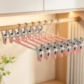 Cintres à pantalon en acier inoxydable rose avec pinces réglables pour jupes et vêtements. - Rose