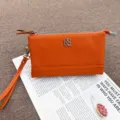 Orange leather coin purse and clutch bag with wrist strap, genuine leather wallet for women. - Orange