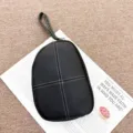 Genuine leather wristlet coin purse with contrast white stitching and secure zipper closure detail. - 20*3*15 cm / Black