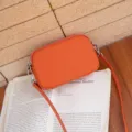 Bolso bandolera de piel auténtica naranja para mujer, pequeño bolso elegante con cremallera. - Naranja