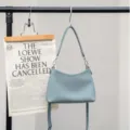 Light blue pebbled leather shoulder bag, stylish crescent design for daily commute. - 25*9*17CM / Sky Blue
