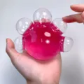Transparent liquid stress relief toy with pink inner gel, fun squeeze hand toy for anxiety. - Crystal Ball (Bubble Popping) / Transparent Pink