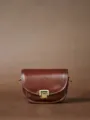 Vintage leather saddle bag for women, classic brown crossbody shoulder bag with metal lock. - Caramel Brown