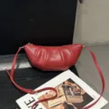 Red leather croissant shoulder bag, chic pleated crossbody bag for women daily commute. - Bright Red