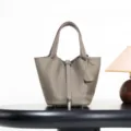 Classic genuine leather bucket bag in taupe with metal lock, elegant daily handbag for women. - 18*13*13 cm / Tin Grey with Silver Buckle