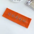 Fascia per capelli in maglia arancione con stelle di strass colorate, elastica e comoda. - Rosso arancio