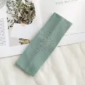 Mintgroene gebreide geribbelde haarband met een sprankelende strass-strik voor dames. - Muntgroen