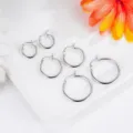 Detailed macro view showing six different sizes of minimalist silver stainless steel hoop earrings - Gauge 2.0mm Inner Diameter 8mm / Steel
