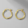 Detail view of golden 316L stainless steel minimalist hoop earrings on a gray background - Gauge 2.0mm Inner Diameter 8mm / Gold