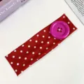 Red polka dot headband with large purple button, cute dopamine style elastic hair accessory. - Red