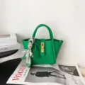 Green genuine leather bucket bag with metal lock and stylish twilly scarf detail. - BV Green [In Stock]