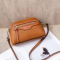 Brown genuine leather crossbody shoulder bag for women, stylish front zipper pocket, compact. - Caramel color