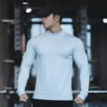 Men's light blue long sleeve athletic mock neck t-shirt, solid color quick dry workout fitness top. - High Neck Light Blue