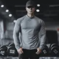 Mens long sleeve athletic fitness workout shirt solid color quick dry stretchy base layer top detail view - High Neck Mottled Gray