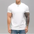 Detail view of a men's plain white short sleeve t-shirt, showing the fit and casual style. - M / Round Neck Top / White