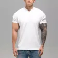 Men's solid white short-sleeve T-shirt with notched neck and textured fabric detail. - M / V-Neck Top / White