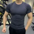 Detail view of mens quick dry fitness short sleeve tight compression t shirt for gym workout. - S / Tops / Dark Gray
