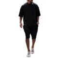 Detailed view of men's vintage washed oversized short sleeve t-shirt and shorts set. - M / Top And Bottom / Black