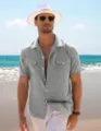 Men's casual short-sleeve linen shirt in grey, featuring a classic lapel and dual pockets. - Light Gray