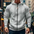 Men's casual zip-up hoodie detail showcasing hooded design, sleeve pockets, and soft fabric. - Light Gray