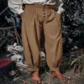 Medieval Renaissance pirate pants for men, loose cotton linen cuffed trousers detail view. - Khaki