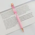 Elegant pink ballpoint pen featuring dried flowers in oil with rose gold metal trim - 1.0mm Bullet Tip / Light Pink