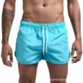 Shorts de plage unicolores pour hommes maillot de bain d'été avec cordon élastique. - Bleu clair
