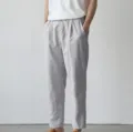 Detail view of men's casual trousers in light gray, comfortable fit for spring and summer. - S / Light Gray