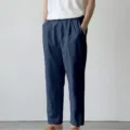 Close-up detail view of men's casual trousers featuring loose fit and comfortable fabric. - S / Navy Blue