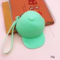 Green silicone baseball cap shaped coin purse mini wallet with keychain strap for daily use. - Green