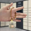 Cute capybara plush keychain with silicone wrist strap, creative cartoon bag pendant charm. - Studying Otter