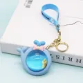 Transparent liquid whale keychain with cute duck inside, stylish bag pendant keyring. - With Small Doll / Blue