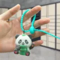 Flocked panda doll keychain with green soft rubber strap bag pendant cute accessory - Flocked Panda with Green Bamboo