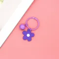 Paarse cartoon bloem sleutelhanger met kleine bel, schattige macaron tas hanger accessoire. - Stijl met bellen / Paarse Kleine Bloem