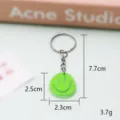 Groene PVC smiley sleutelhanger, schattige cartoon autosleutelhanger hanger en tasaccessoire. - 5,5*3,5*0,3 cm / Sleutelhangerstijl - Groen smileygezicht