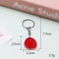 Rode smiley sleutelhanger schattige PVC zachte rubberen ring hanger tas bedel accessoire leuk. - 5,5*3,5*0,3 cm / Sleutelhangerstijl - Rood smileygezicht