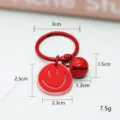 Schattige rode smiley sleutelhanger met kleine bel en ring, leuk als tas hanger en cadeau. - Stijl met bellen / Rood Smiley Gezicht