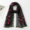 Detailed close-up of the black sheer embroidered long scarf with vibrant pink floral patterns. - Black / 180*60cm