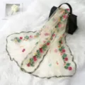 Detail view of a lightweight sheer embroidered floral long scarf, sheer mesh with colorful roses. - Light Yellow