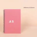 Minimalist pink A5 spiral notebook with 140x210mm dimensions for school and office use. - A5 / Pink (Lined)