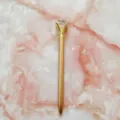 Elegant rose gold metal ballpoint pen featuring a stunning large crystal diamond on top - 1.0mm Bullet Tip / Champagne Gold