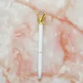 White and gold metal ballpoint pen featuring a large creative crystal diamond topper design - 1.0mm Bullet Tip / White