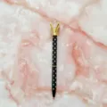 Elegant black polka dot ballpoint pen with a large crystal diamond top and gold accents - 1.0mm Bullet Tip / Black Barrel with White Polka Dots