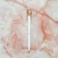 Elegant white ballpoint pen featuring a large rose gold crystal diamond top on marble - 1.0mm Bullet Tip / White Barrel with Rose Gold Polka Dots